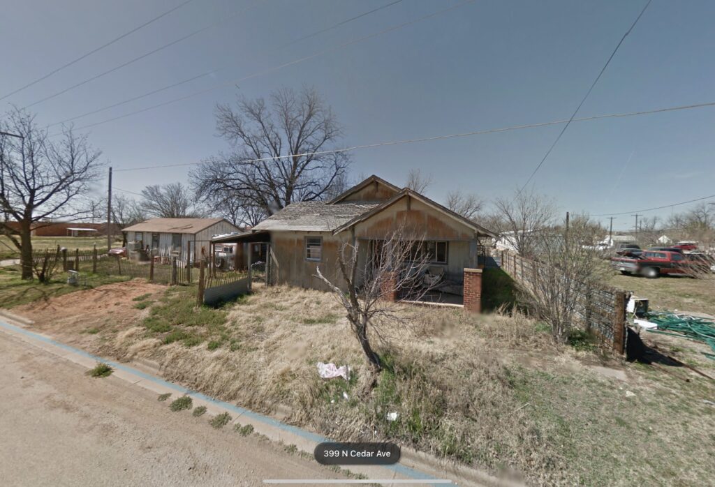 Fixer house in Downtown Munday , Texas LAND IS HOME